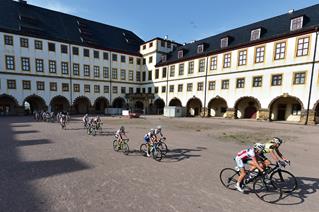 Stage 1: Across Friedenstein Castle's courtyard in Gotha, on their way to km 0